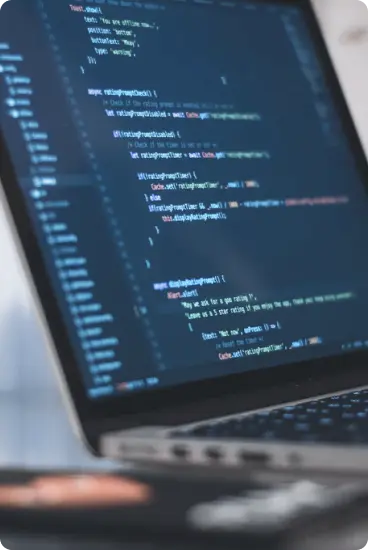 Laptop screen showing coding in progress